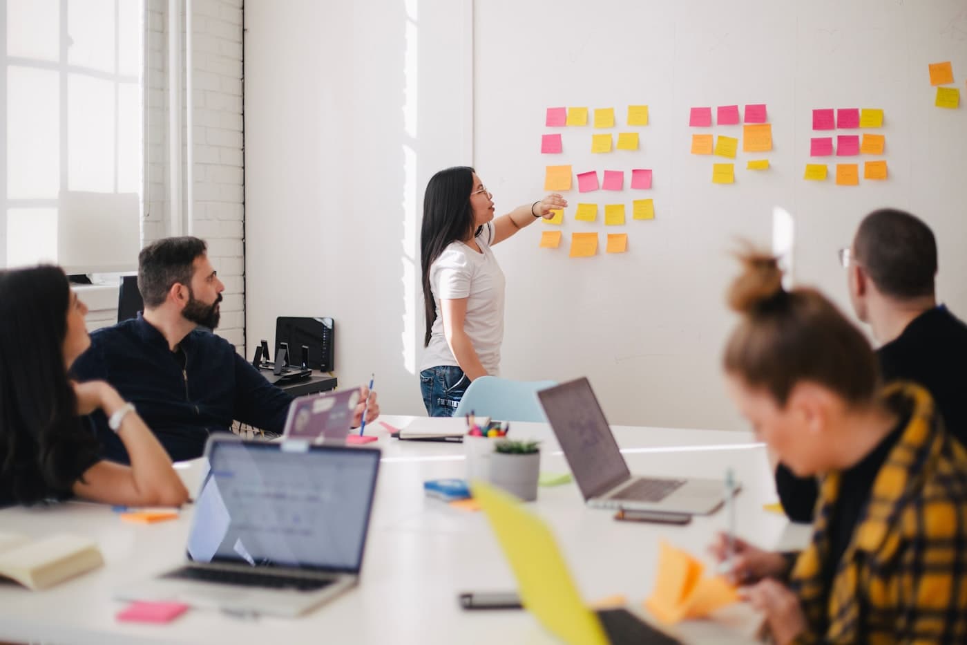Sticky notes and diagrams on a wall during a planning session
